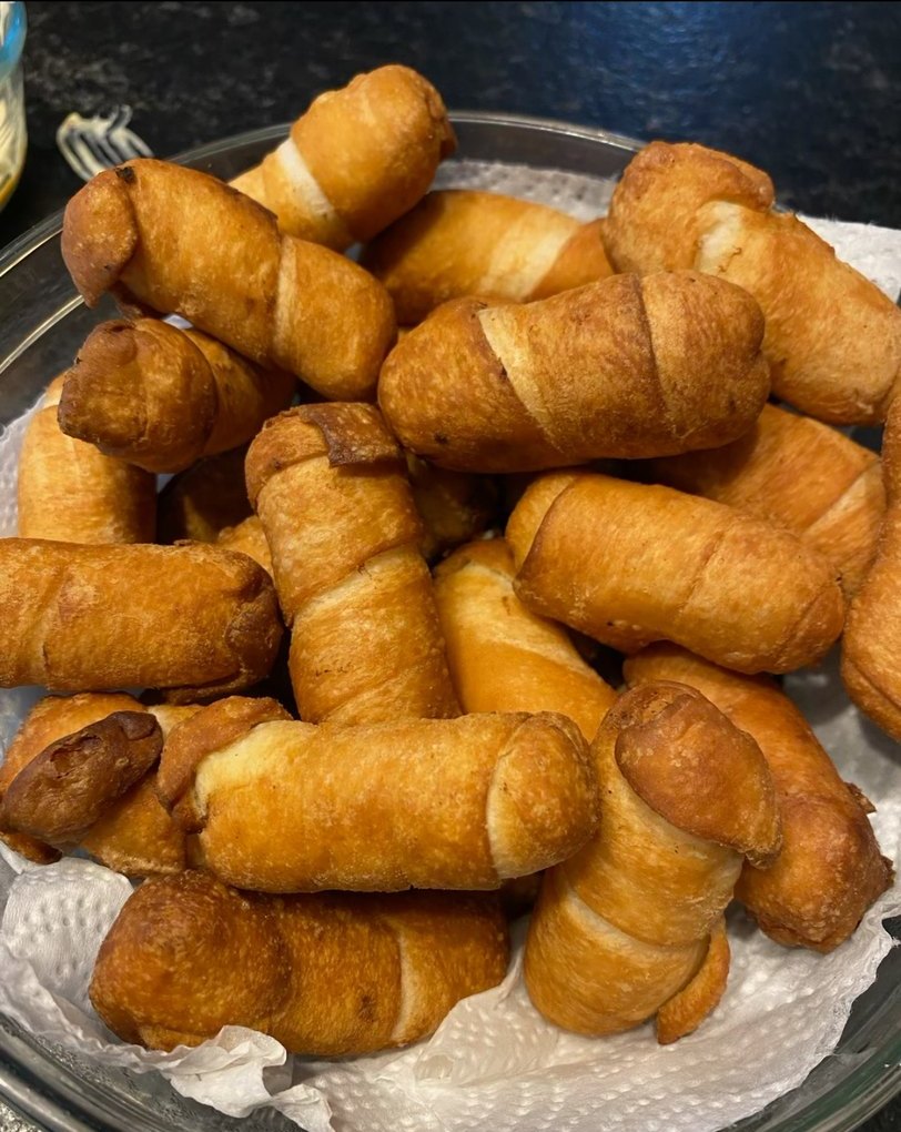 A bowl of golden fried tequeños